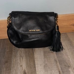 Michael Kors black handbag. Sizing: 12” W x 9”H x 8” D opening